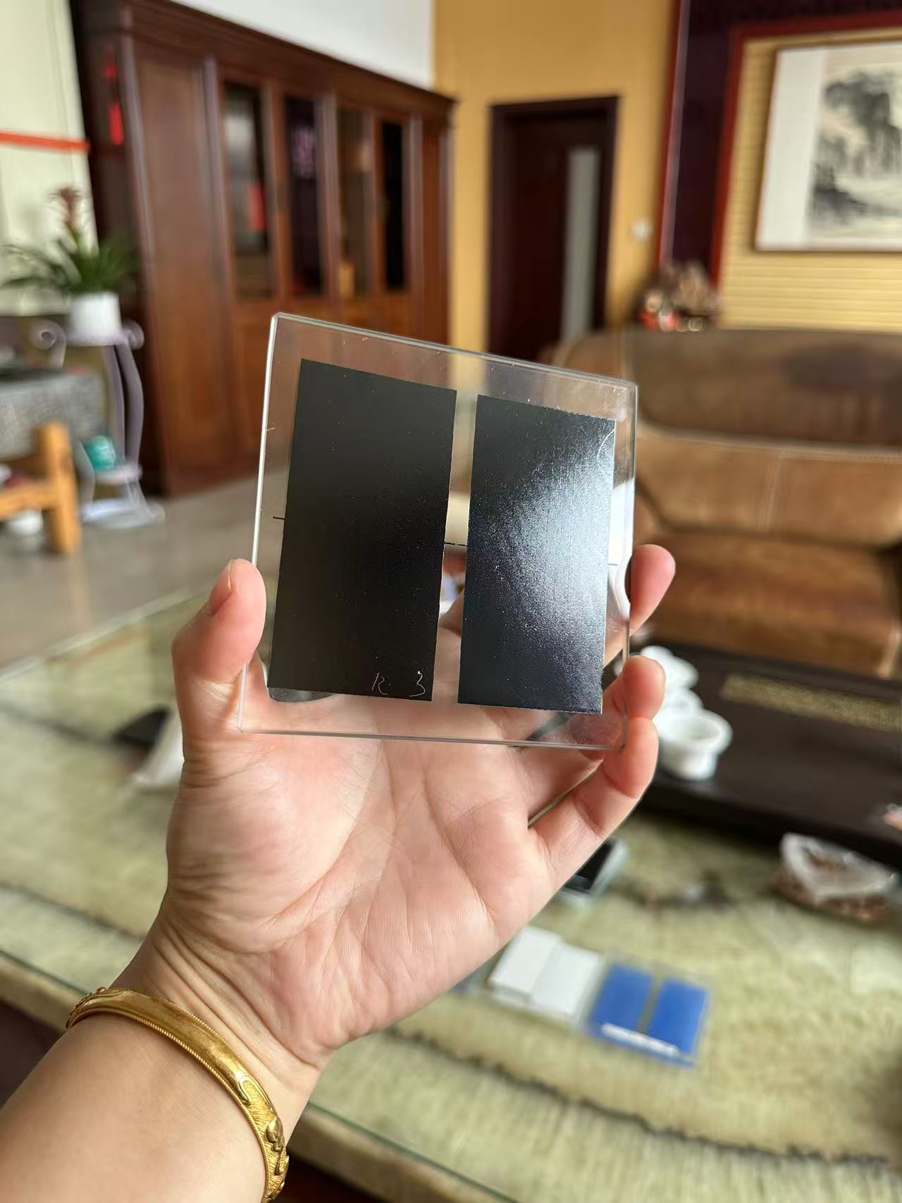 Black circular material sample